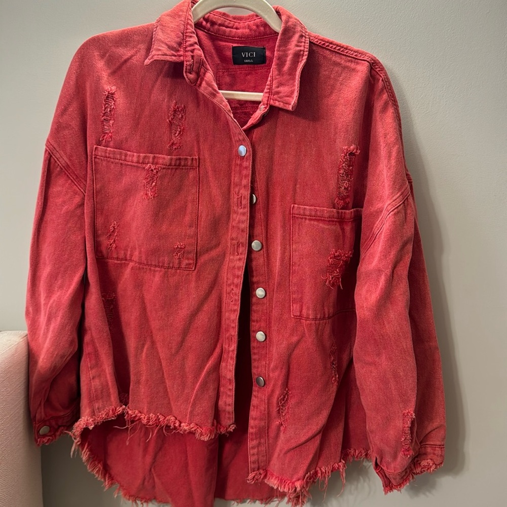 Vici distressed red denim jacket.